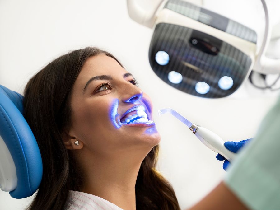 Patient receiving cosmetic teeth whitening treatment 5 questions to ask your general dentist about new technologies